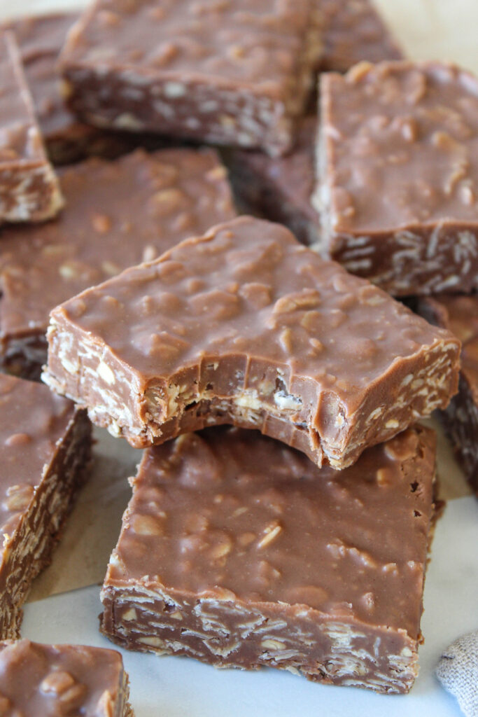 Chewy no‑bake chocolate peanut butter oat bars with a bite taken out