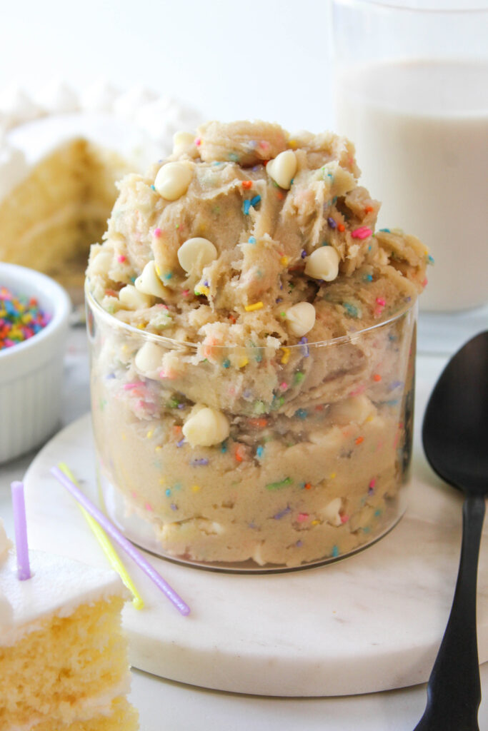 Bowl of funfetti cookie dough with colorful sprinkles and white chocolate chips