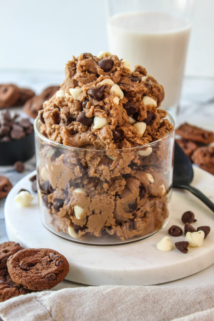 Close-up of creamy edible cookie dough loaded with two types of chocolate chips