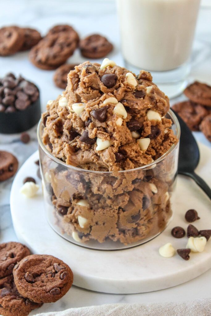 Rich chocolate cookie dough with chunks of milk and white chocolate chips on top