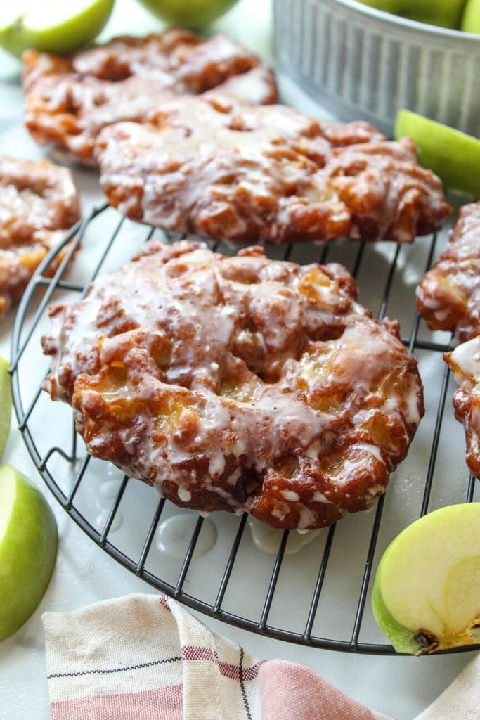 Warm apple fritters with tender apple pieces and golden brown crust
