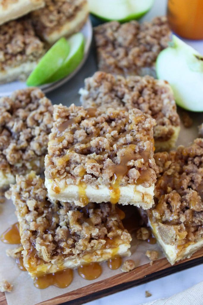 Caramel apple cheesecake bars cut into neat squares for serving