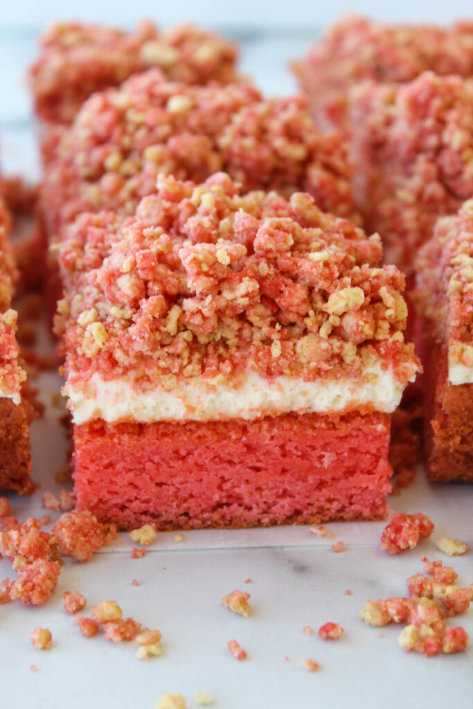 Strawberry crunch cheesecake brownies cut into squares