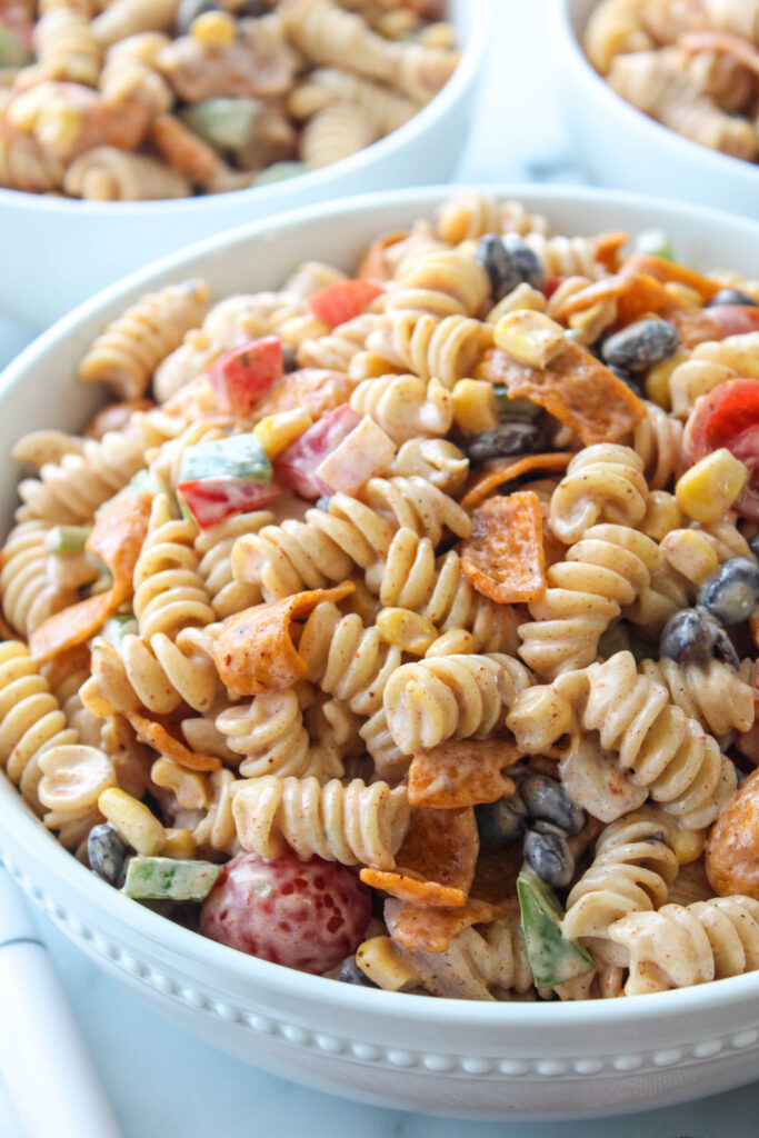 Ranch taco pasta salad with rotini, black beans, corn, tomatoes, and creamy ranch dressing