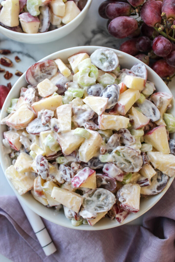 Creamy Waldorf salad made with crisp apples, juicy grapes, and chopped pecans