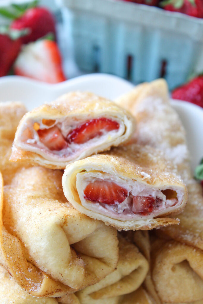 Easy strawberry cheesecake chimichangas with creamy cheesecake filling and crispy tortillas