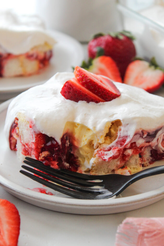 Layered Strawberry Heaven dessert topped with strawberry pie filling