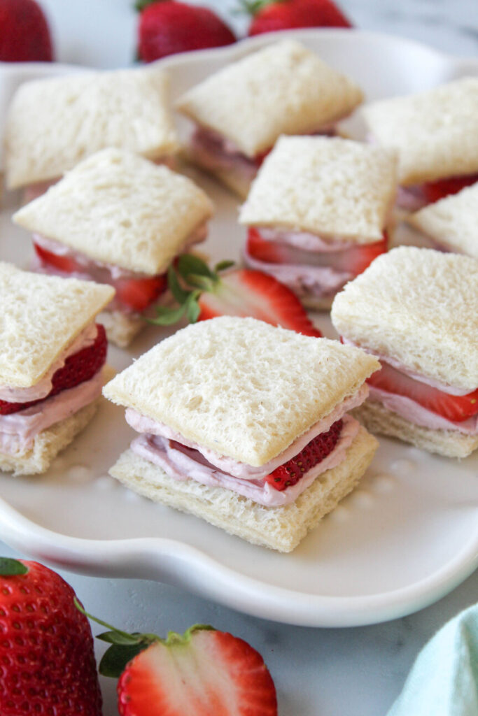 Strawberry tea sandwiches on a serving platter
