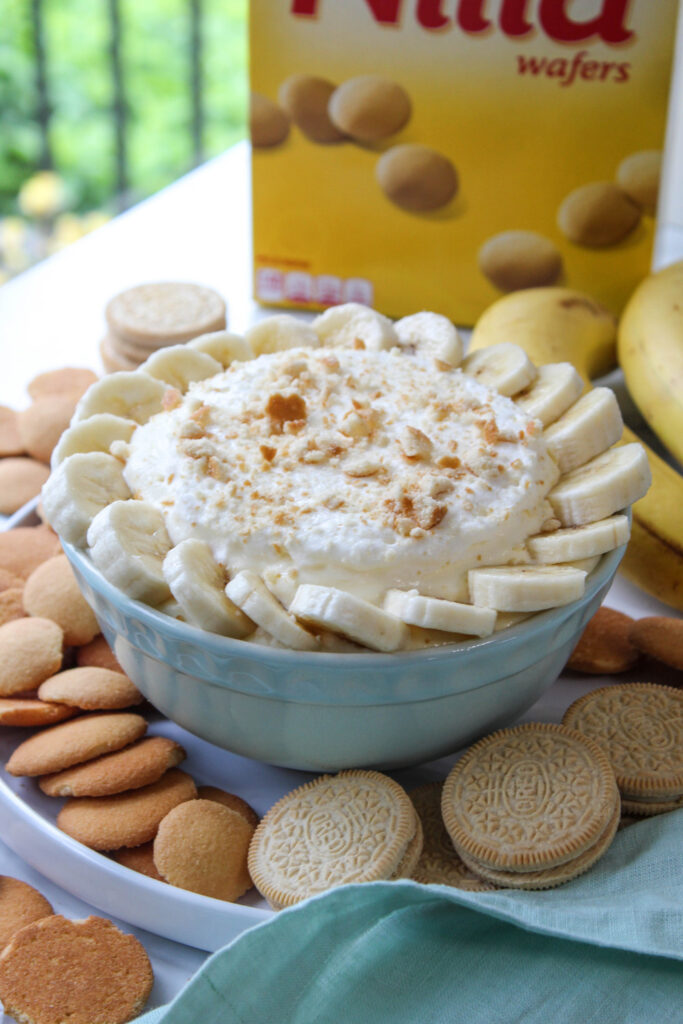 Banana cream pie dip topped with banana slices and crushed vanilla wafers
