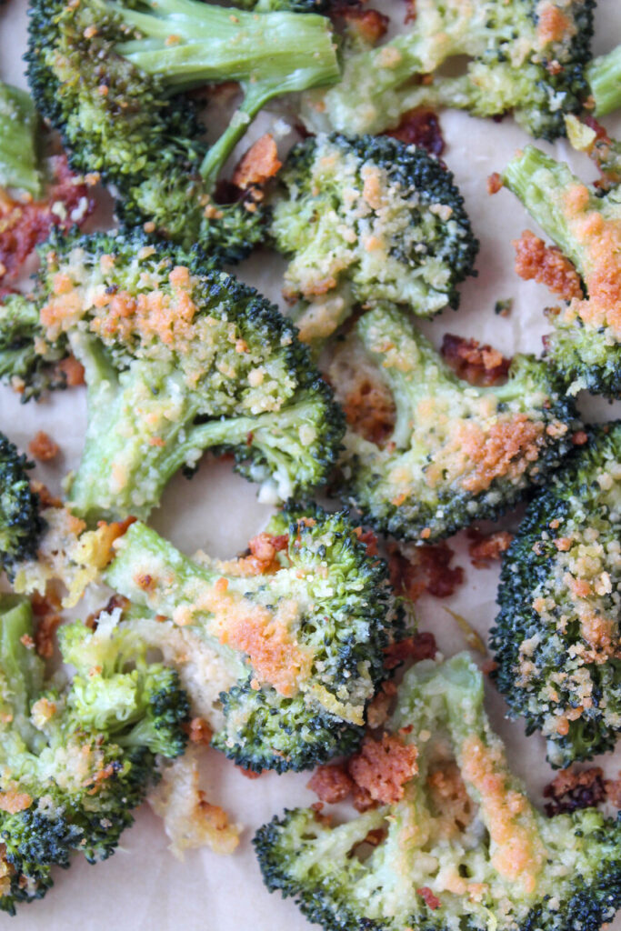 Close-up of roasted smashed broccoli sprinkled with parmesan