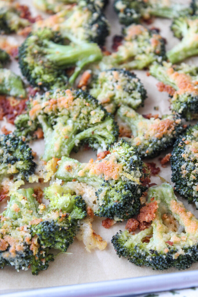 Crispy smashed broccoli florets with melted parmesan on top