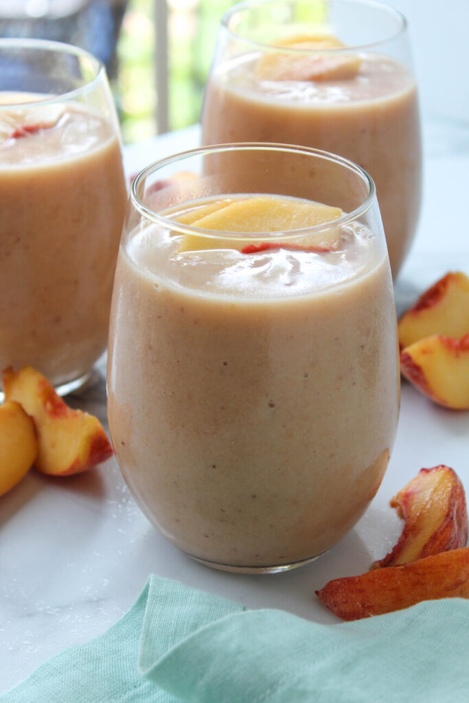 Healthy homemade peach smoothie served cold, quick and easy drink