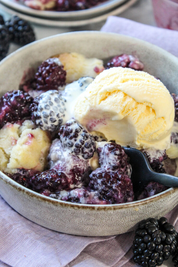 Close-up of easy blackberry cobbler filled with sweet blackberries