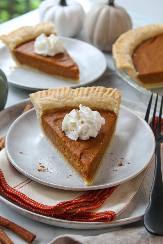 Homemade vegan pumpkin pie with a smooth pumpkin filling and flaky crust