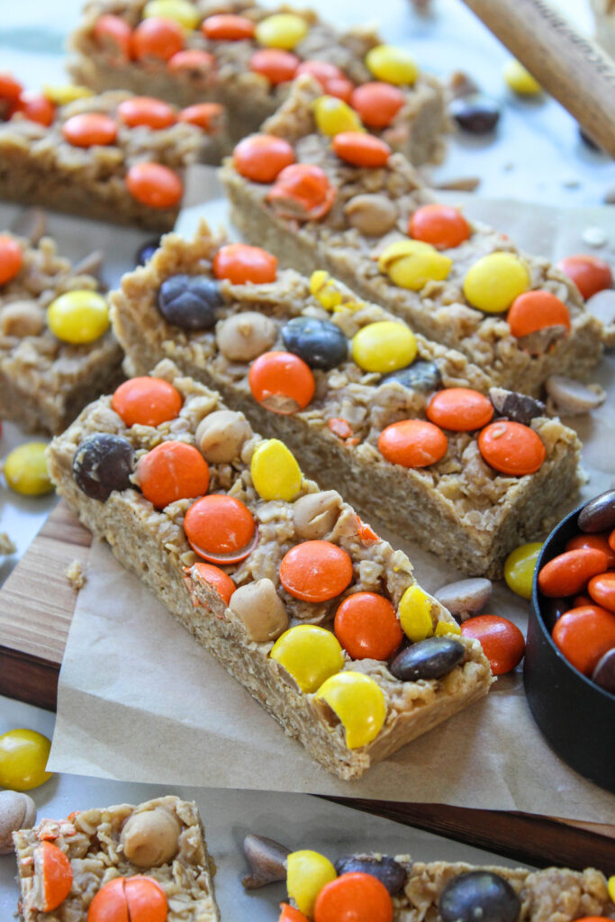 Peanut butter granola bars made from scratch on a wooden cutting board
