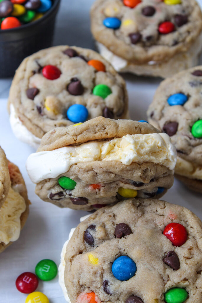 Homemade monster cookie ice cream sandwich with colorful M&M candies
