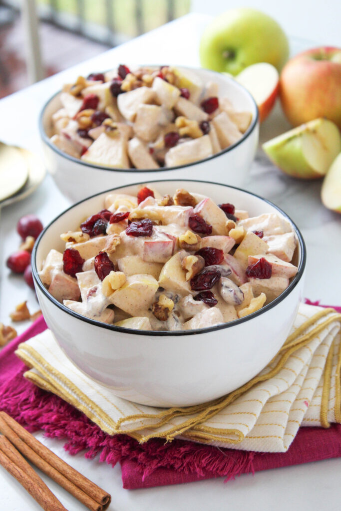 Fresh apple salad with cinnamon, walnuts, and a sweet creamy coating