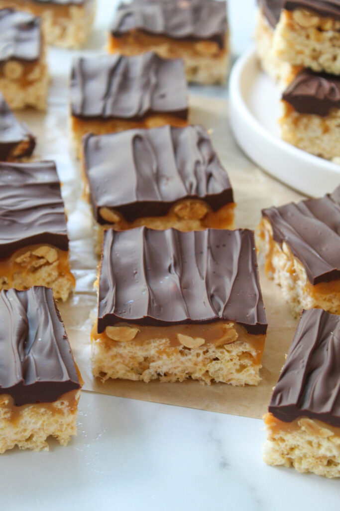 Detailed view of Snickers Rice Krispie bar showing caramel