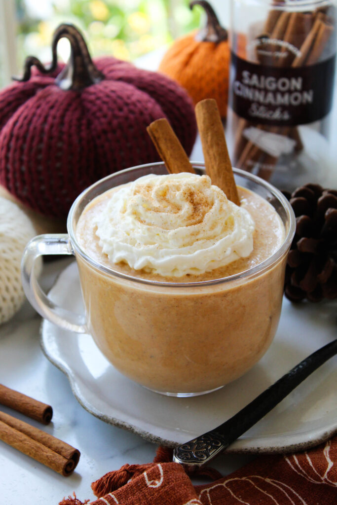 Pumpkin spice hot chocolate with seasonal fall decorations
