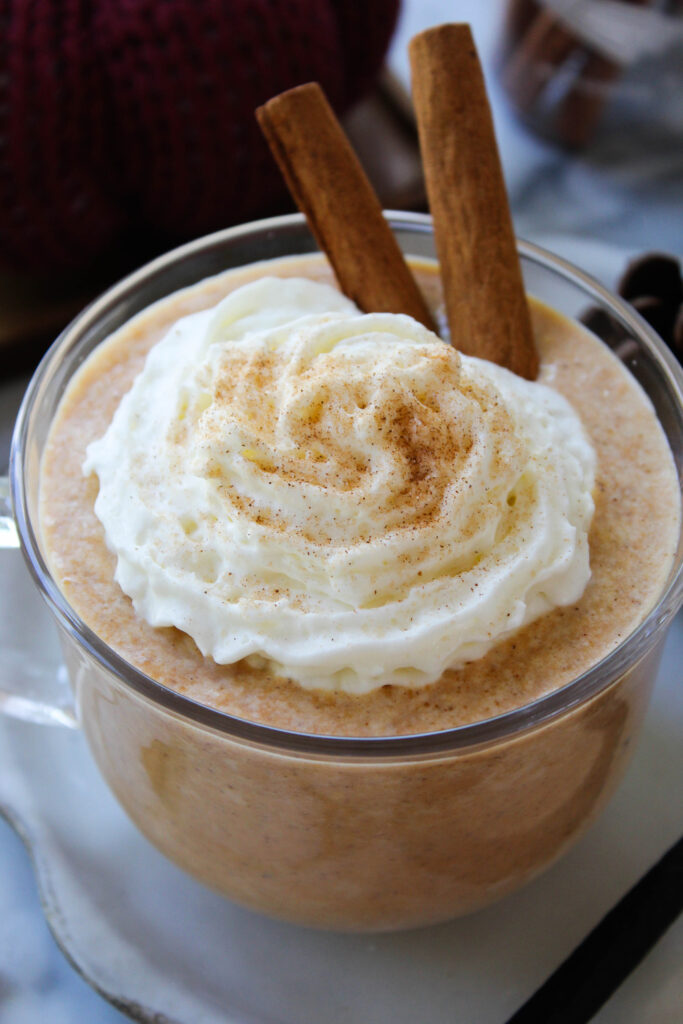 Warm pumpkin spice hot chocolate garnished with pumpkin pie spice