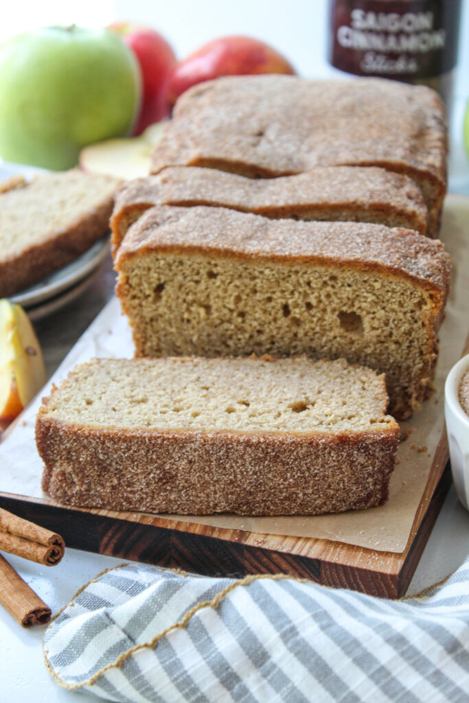 Apple cider donut bread coated in cinnamon sugar and sliced for serving