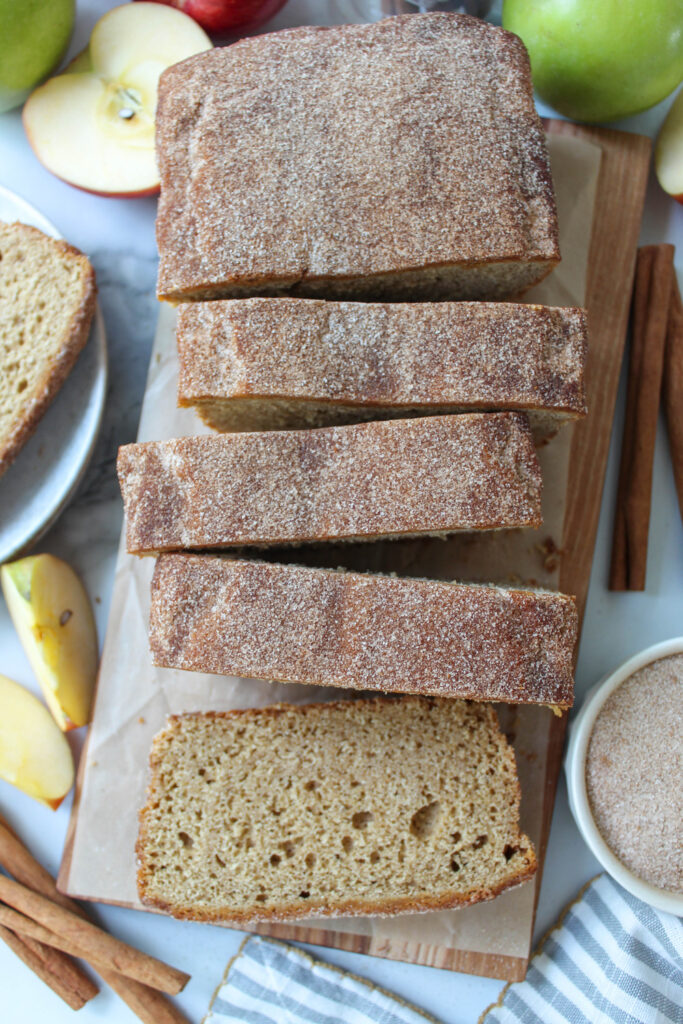 Homemade apple cider donut bread with a moist crumb and cinnamon topping