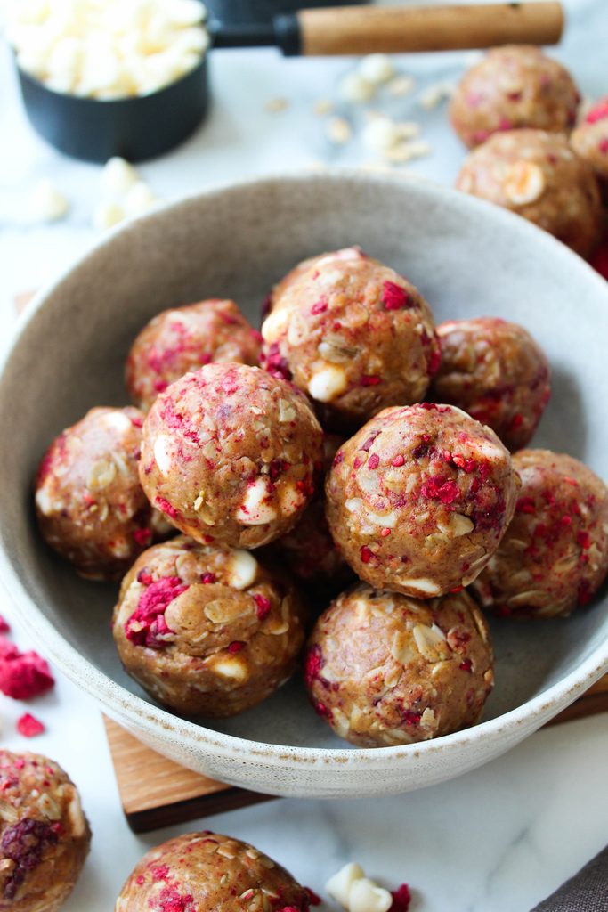 White chocolate raspberry protein balls with creamy texture and bright berry specks
