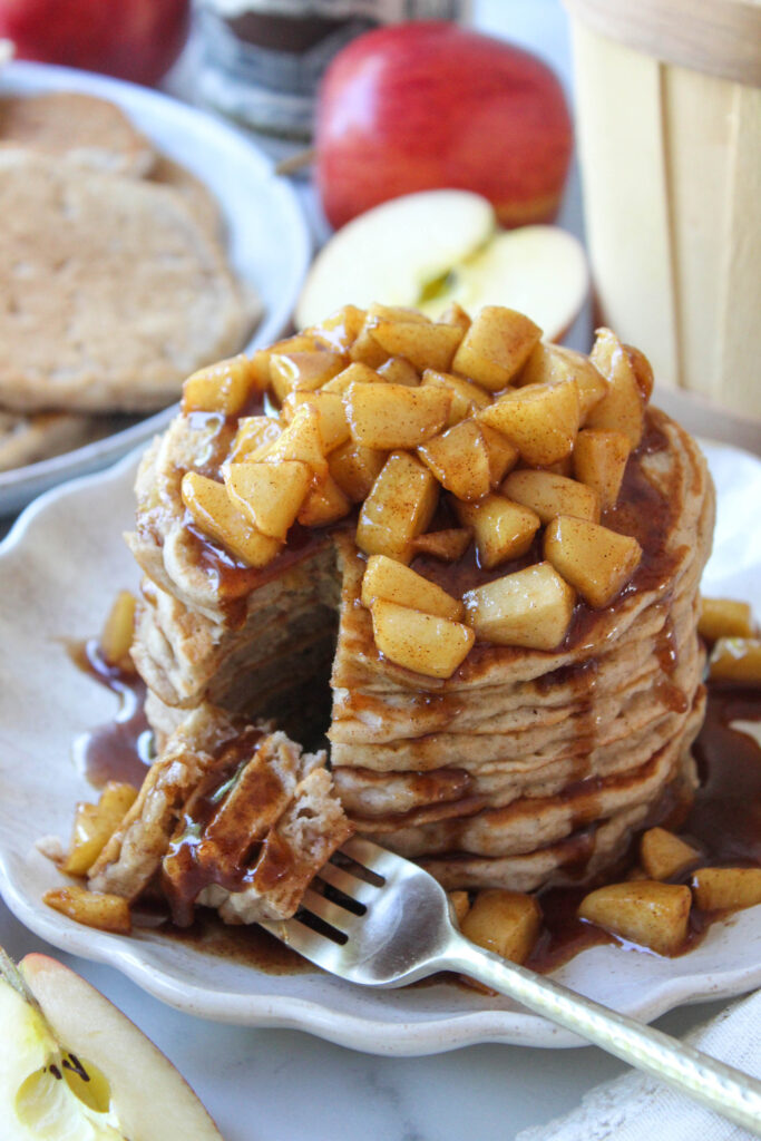 Freshly made apple cinnamon pancakes topped with sautéed apples and cinnamon