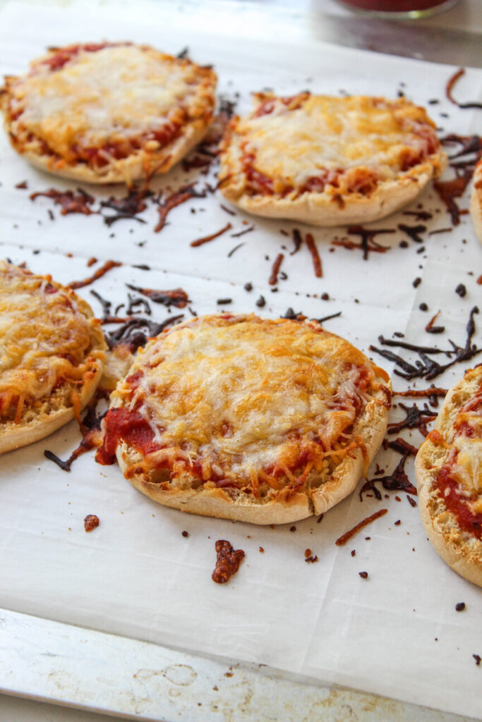 Mini English muffin pizzas with gooey melted mozzarella cheese