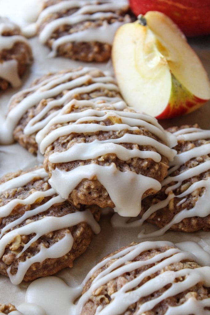 Apple cinnamon oatmeal cookies with visible oats and warm cinnamon speckles