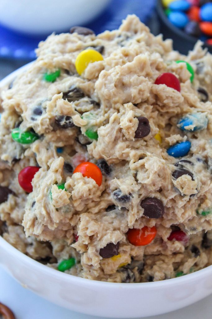 Chunky monster cookie dough dip loaded with oats, chocolate chips, and M&Ms