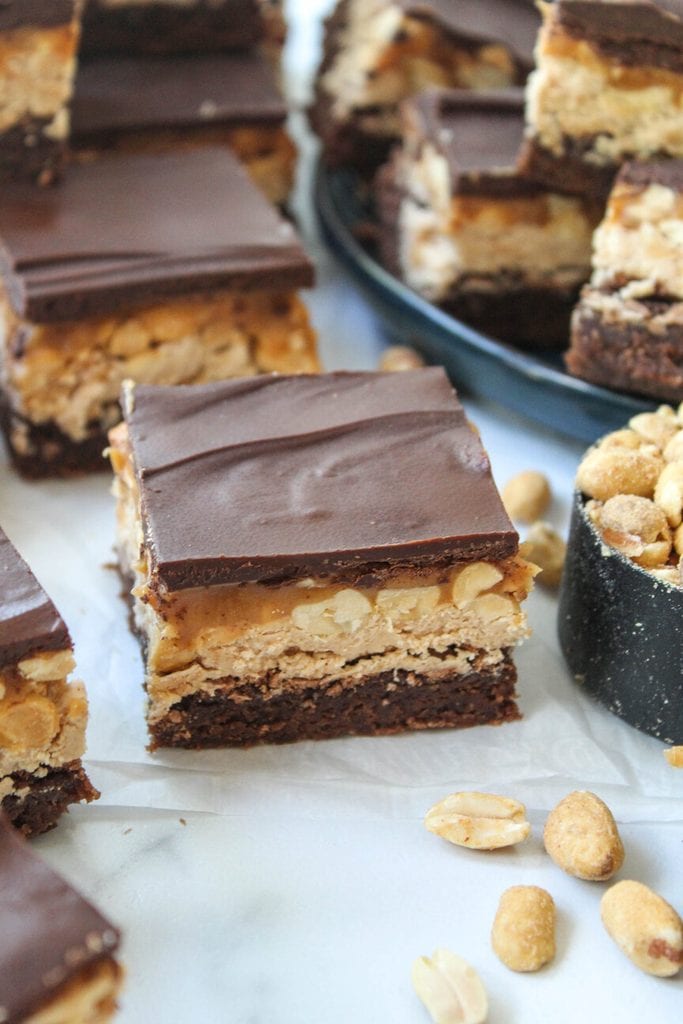 Snickers brownies with gooey caramel layer and shiny chocolate topping