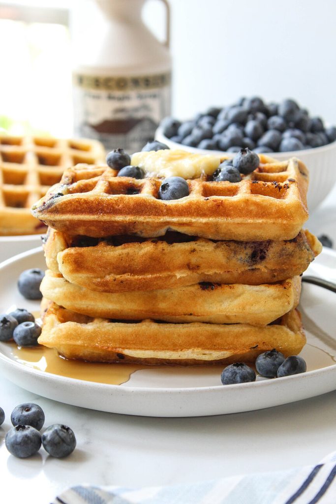 Freshly cooked blueberry waffles with crisp edges and soft centers