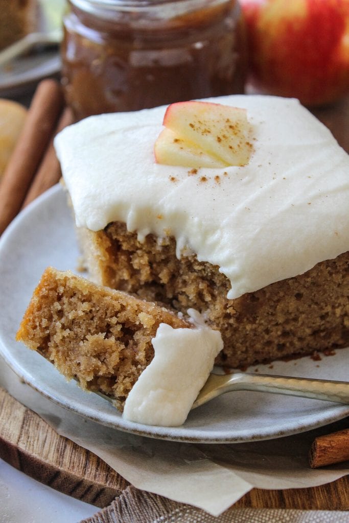 Moist apple butter cake cut into squares for serving
