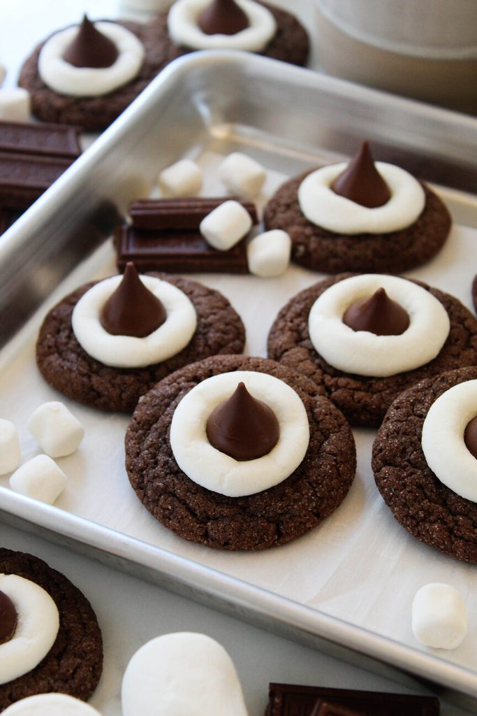 Hot chocolate cookie blossoms topped with Hershey’s kisses