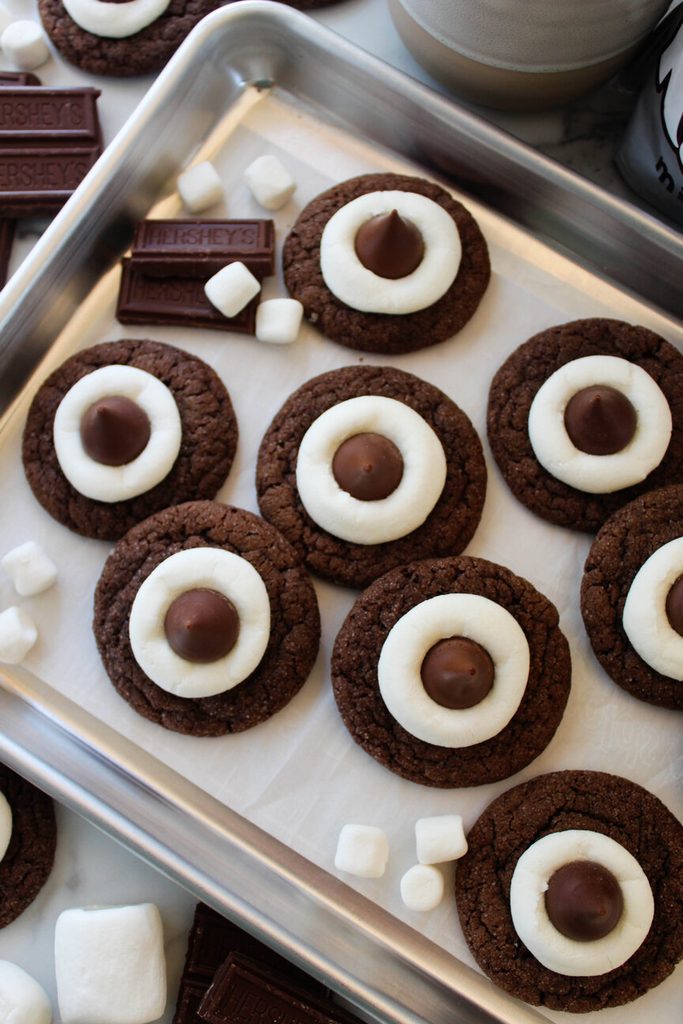 Soft hot cocoa cookie blossoms with crackly cocoa tops