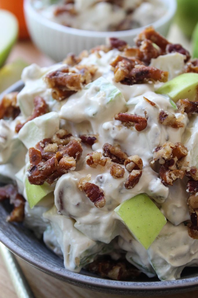 Caramel apple crackle salad with layers of apples, caramel, and whipped cream